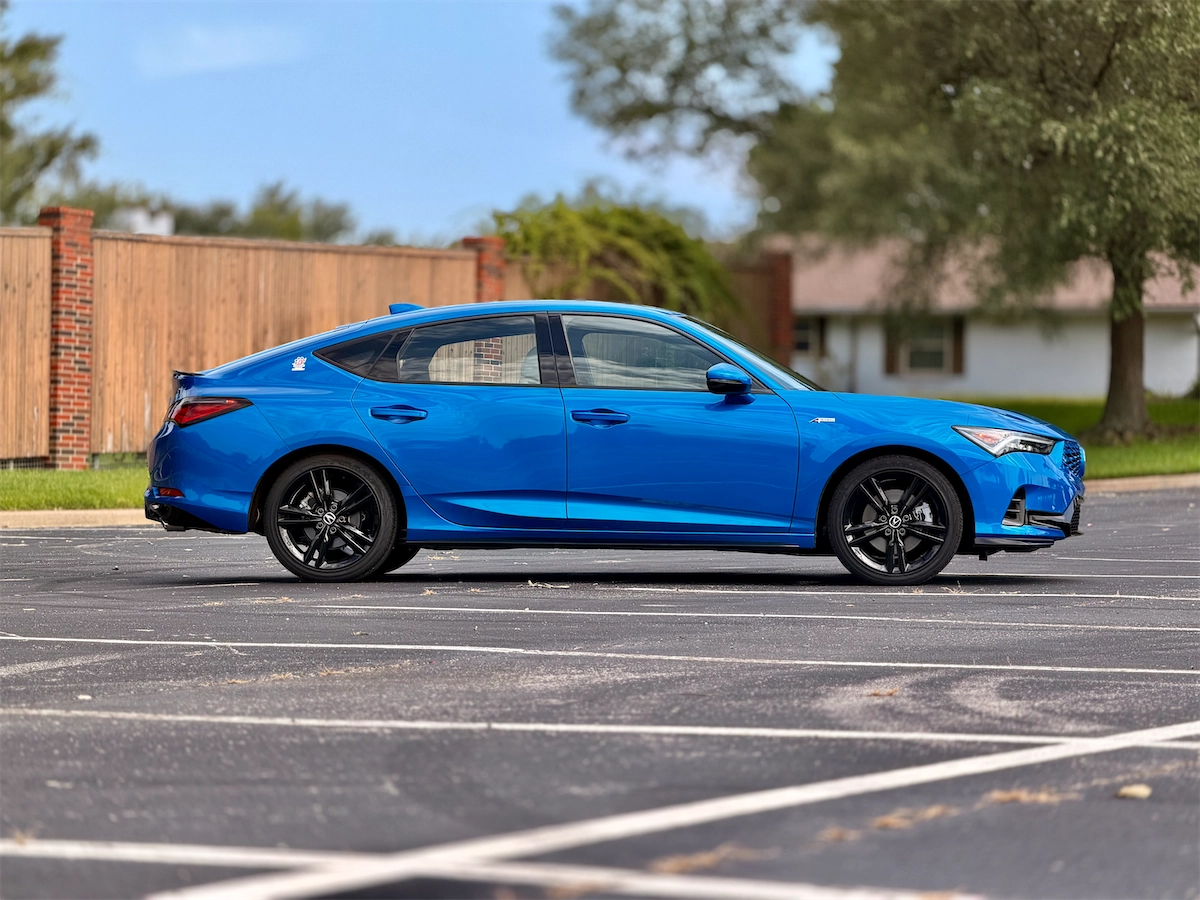 Blue Acura Integra A-Spec parked in a lot
