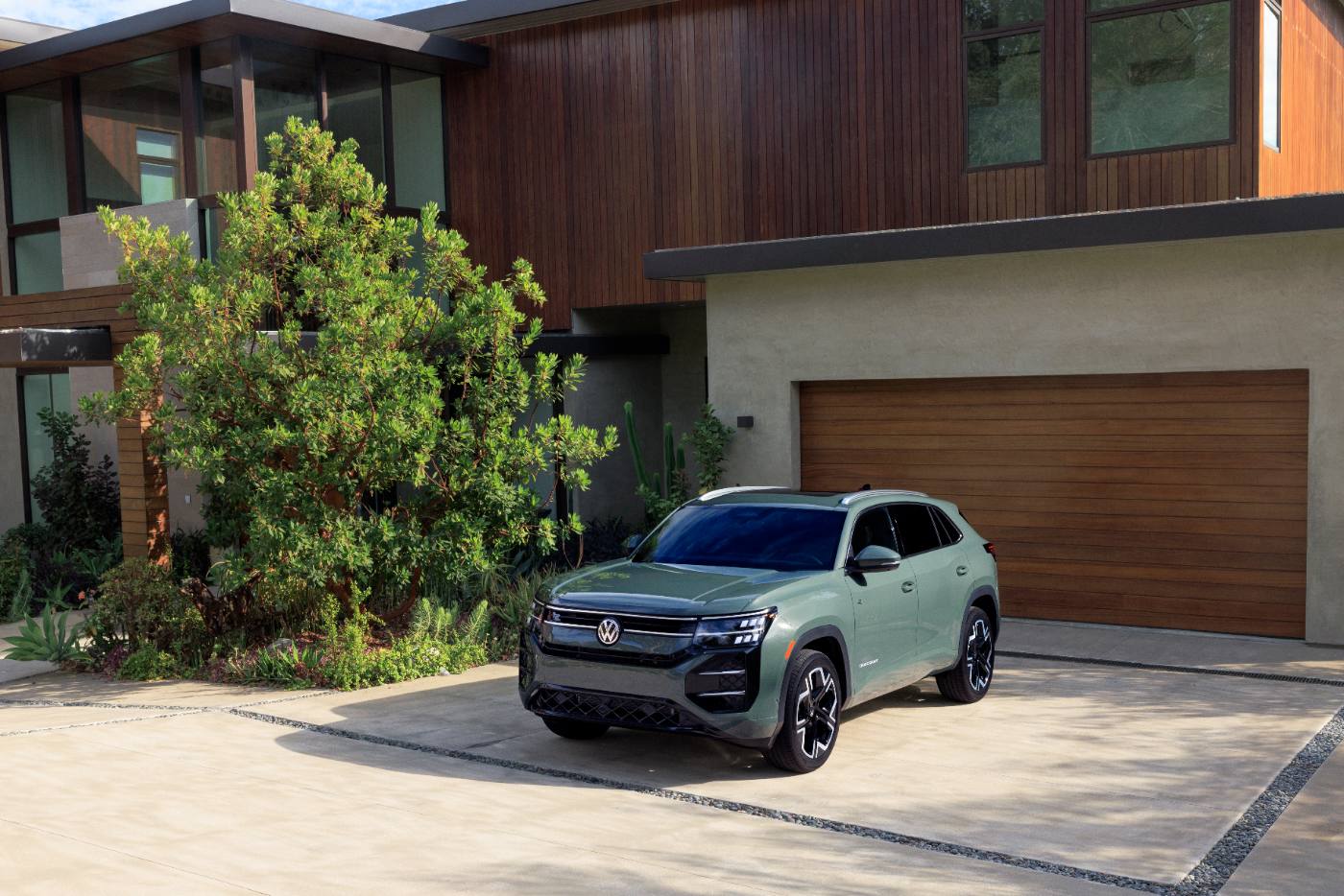 2027 VW Atlas Cross Sport parked in a driveway, front three-quarter view