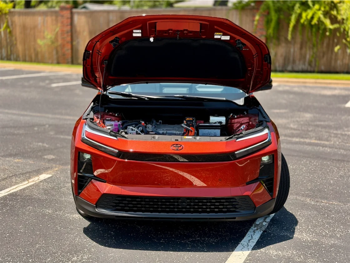 Open hood of the 2026 Toyota C-HR XSE revealing the electric powertrain hardware where a front trunk would normally sit