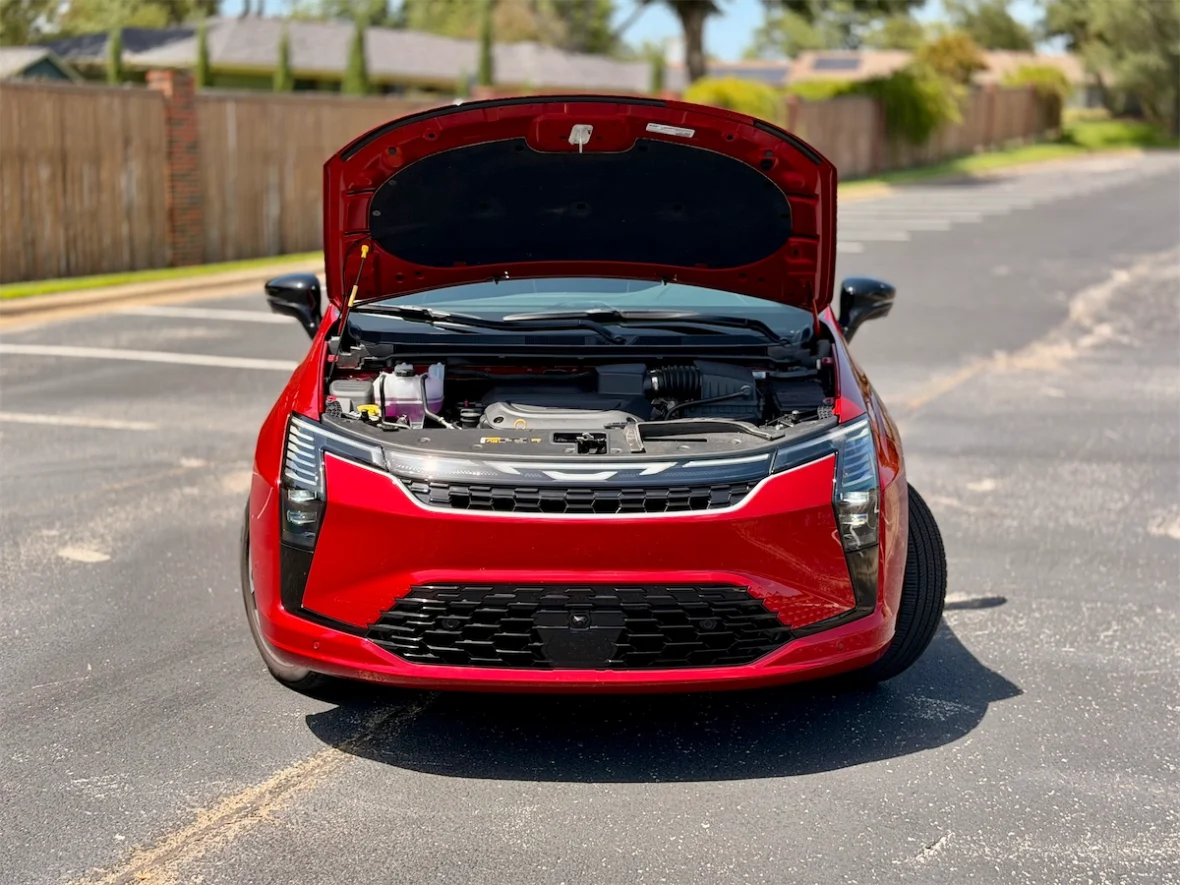 Red 2027 Chrysler Pacifica with the hood open showing the engine bay