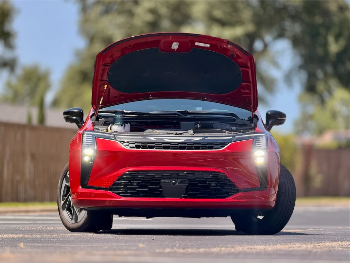 Red 2027 Chrysler Pacifica front three-quarter with the hood raised