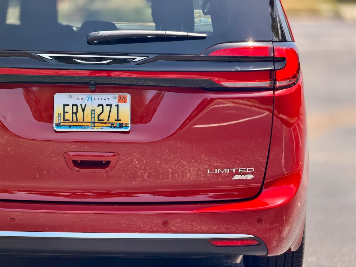 Rear three-quarter taillight and Limited AWD badge of a 2027 Chrysler Pacifica