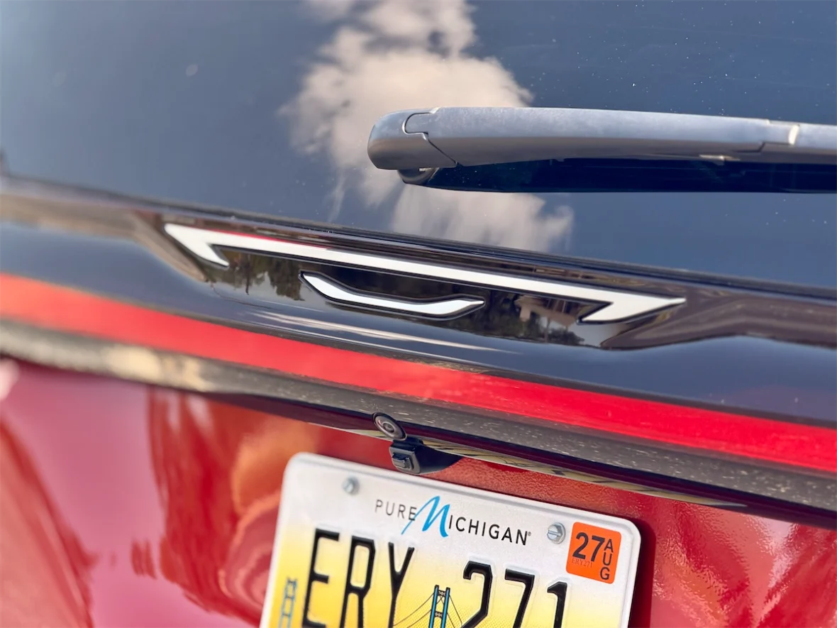 Rear wiper, Chrysler badge and license plate on a 2027 Chrysler Pacifica