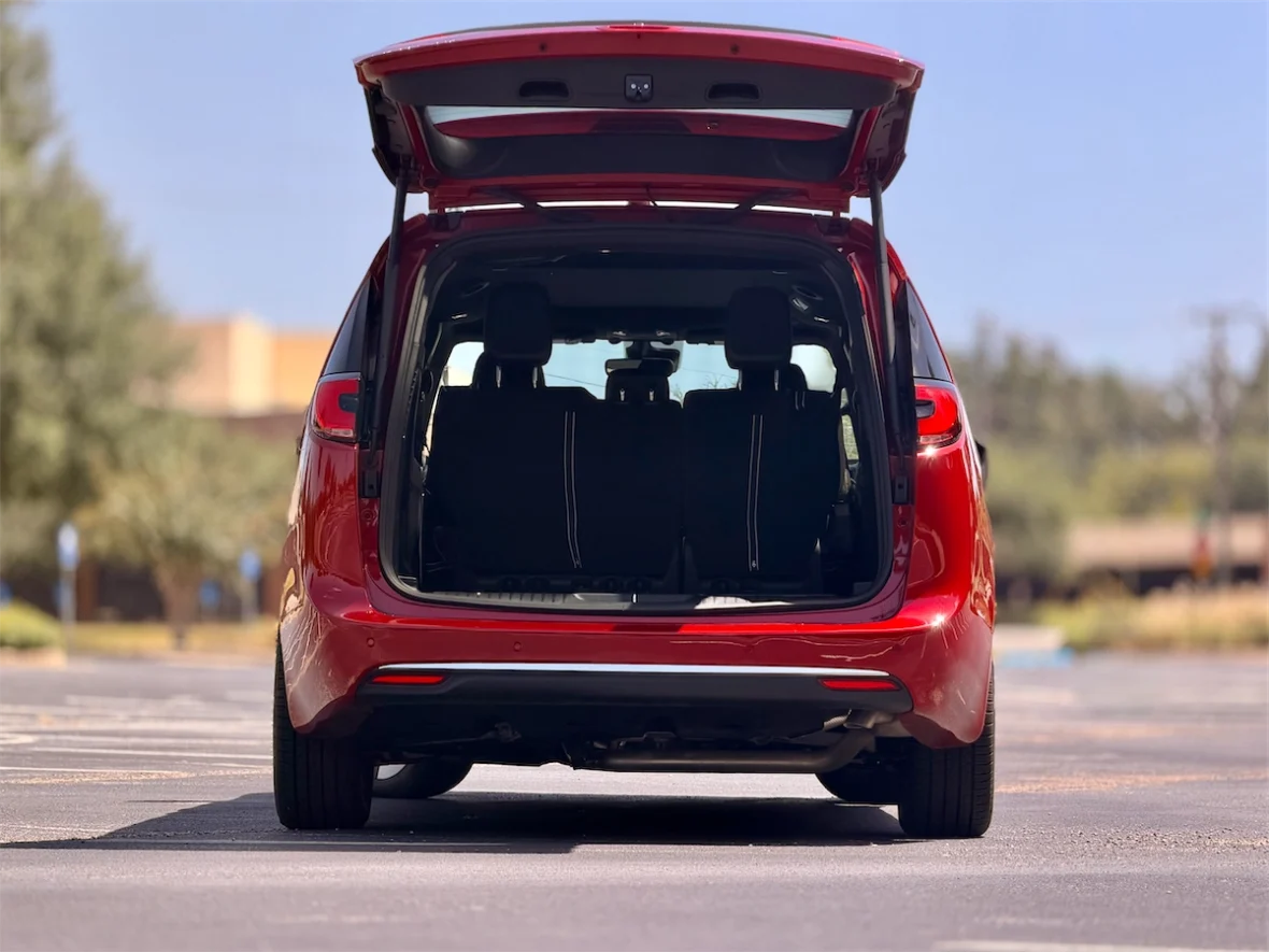 Red 2027 Chrysler Pacifica with the liftgate open showing the cargo area