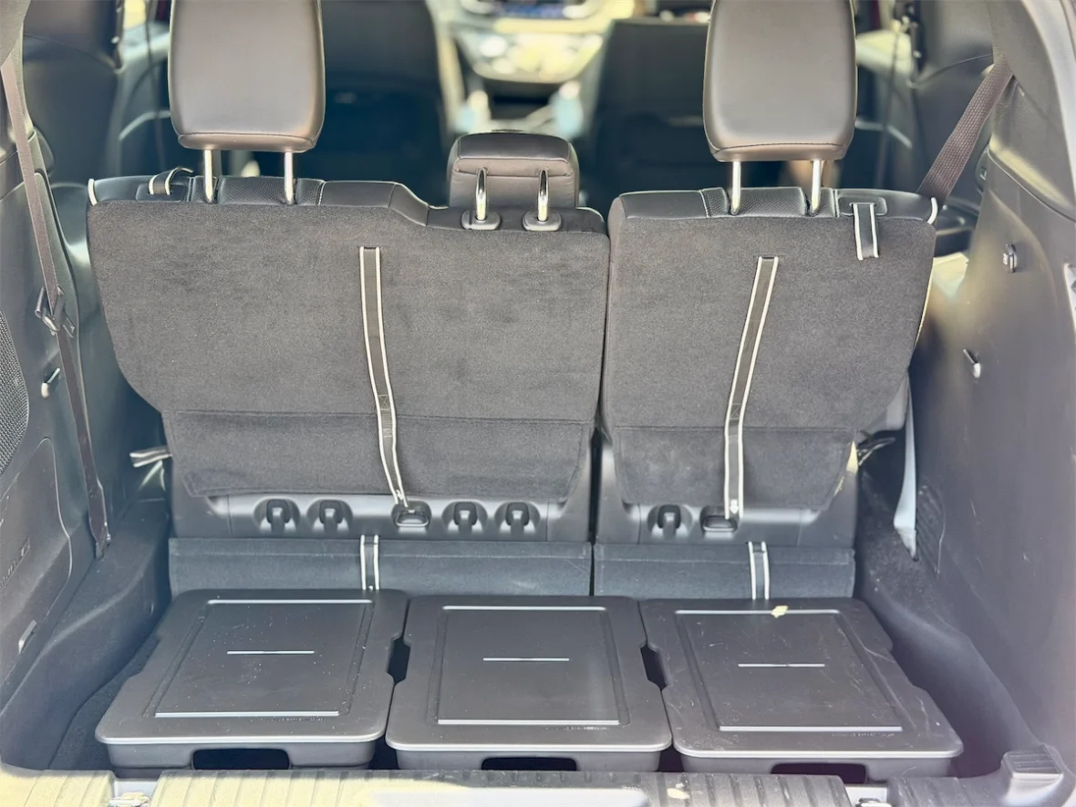 Third-row seats upright in a 2027 Chrysler Pacifica viewed from the cargo area