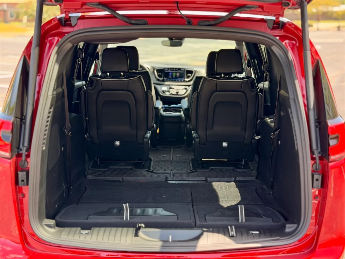 View toward the dashboard from the cargo area of a 2027 Chrysler Pacifica