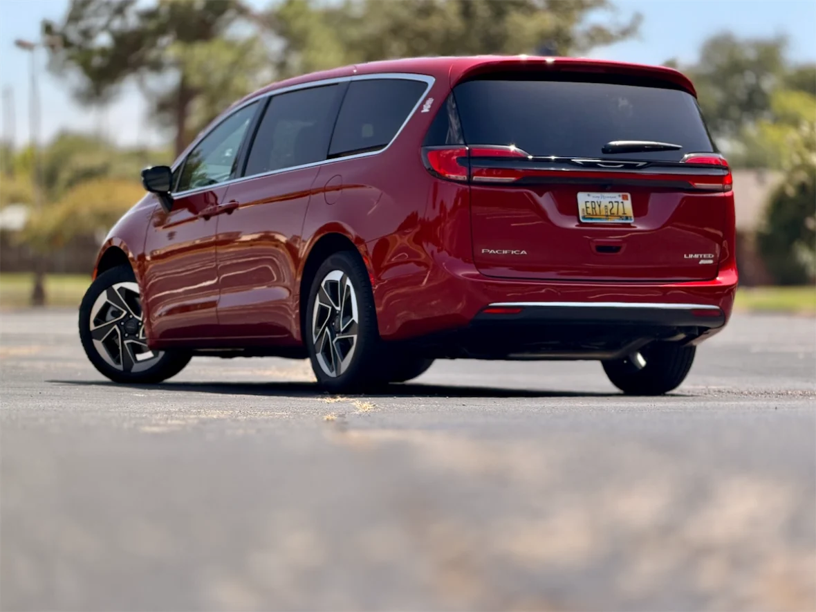 Rear three-quarter profile of a red 2027 Chrysler Pacifica Limited AWD