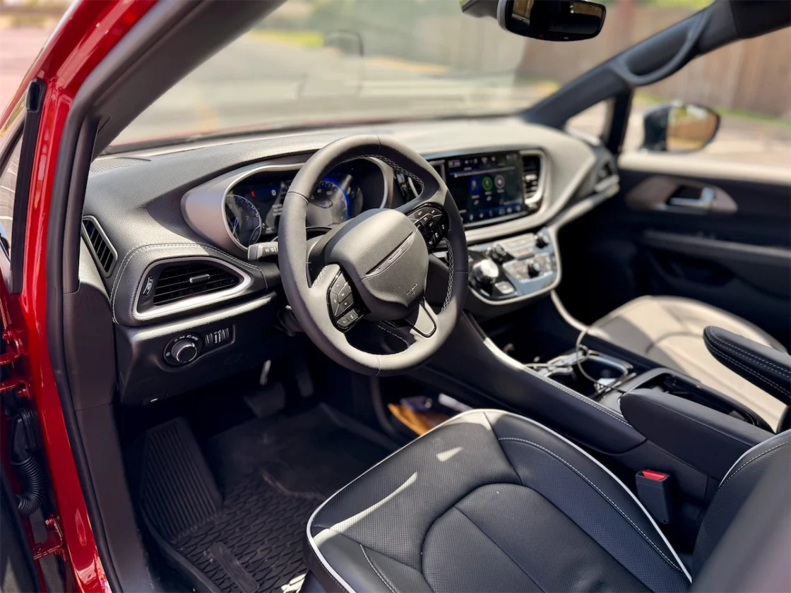 Steering wheel, gauges and Uconnect screen in a 2027 Chrysler Pacifica