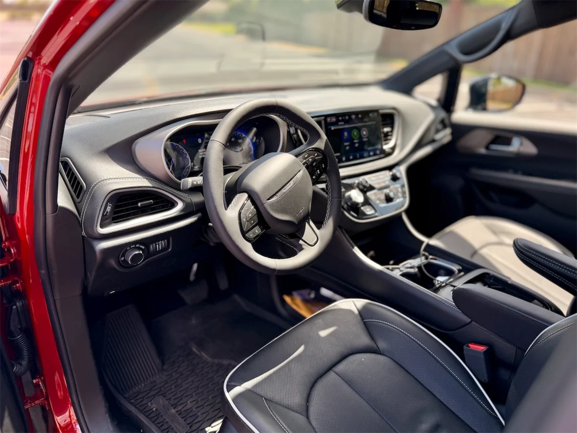 Steering wheel, gauges and Uconnect screen in a 2027 Chrysler Pacifica