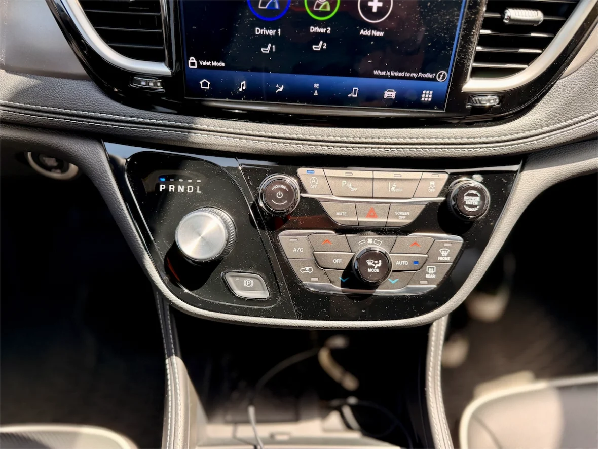 Center stack with the Uconnect 5 screen and climate controls in a 2027 Chrysler Pacifica