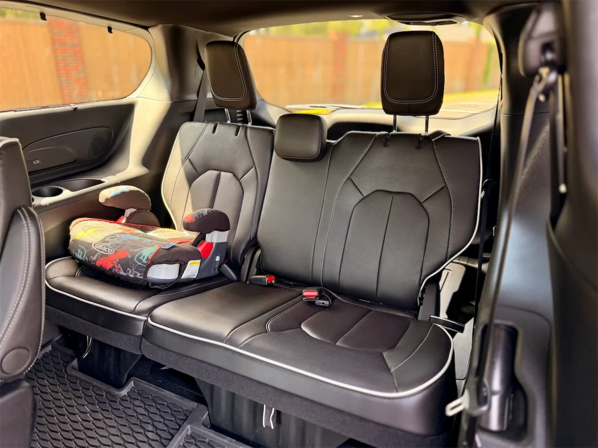 Third-row bench seat with a child booster in a 2027 Chrysler Pacifica