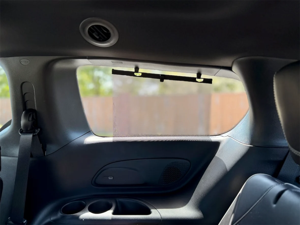 Third-row storage cubby and cupholders in a 2027 Chrysler Pacifica