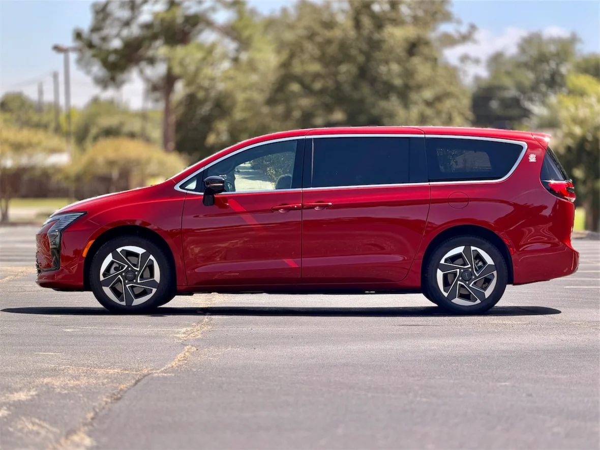 Full side profile of a red 2027 Chrysler Pacifica Limited AWD
