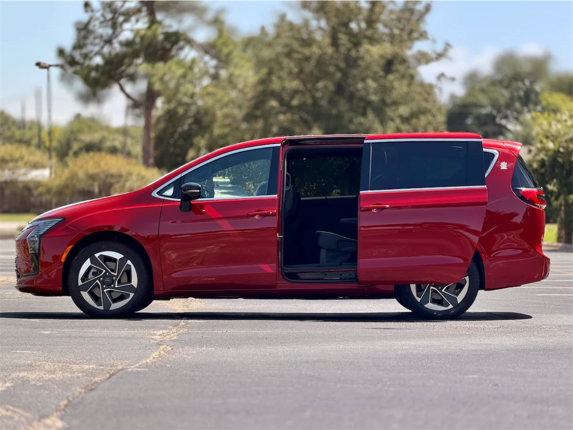 Red 2027 Chrysler Pacifica profile with the sliding door open
