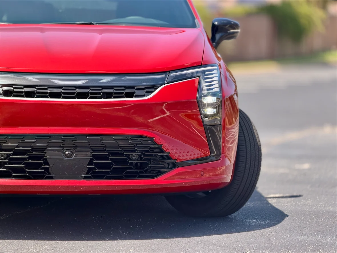 Front grille detail of a red 2027 Chrysler Pacifica
