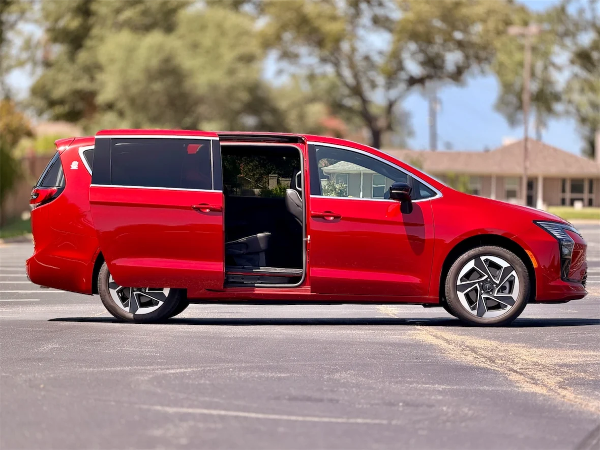 Red 2027 Chrysler Pacifica profile with the power sliding door open