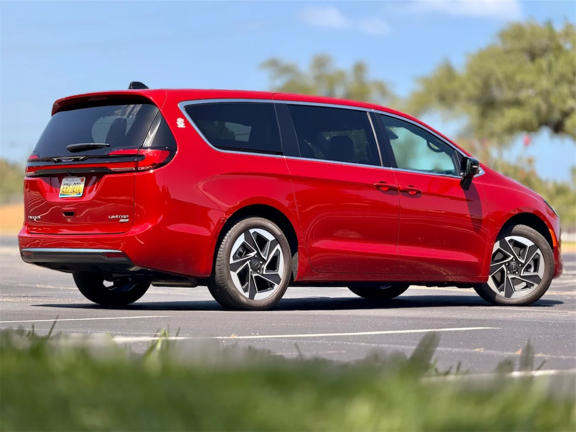 Rear three-quarter view of a red 2027 Chrysler Pacifica Limited AWD