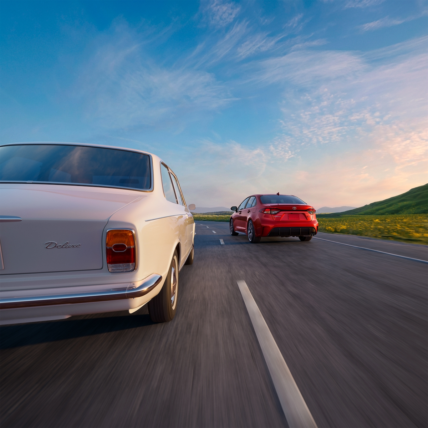 Classic Corolla and the new 2027 Toyota Corolla 60th Anniversary Edition on an open road