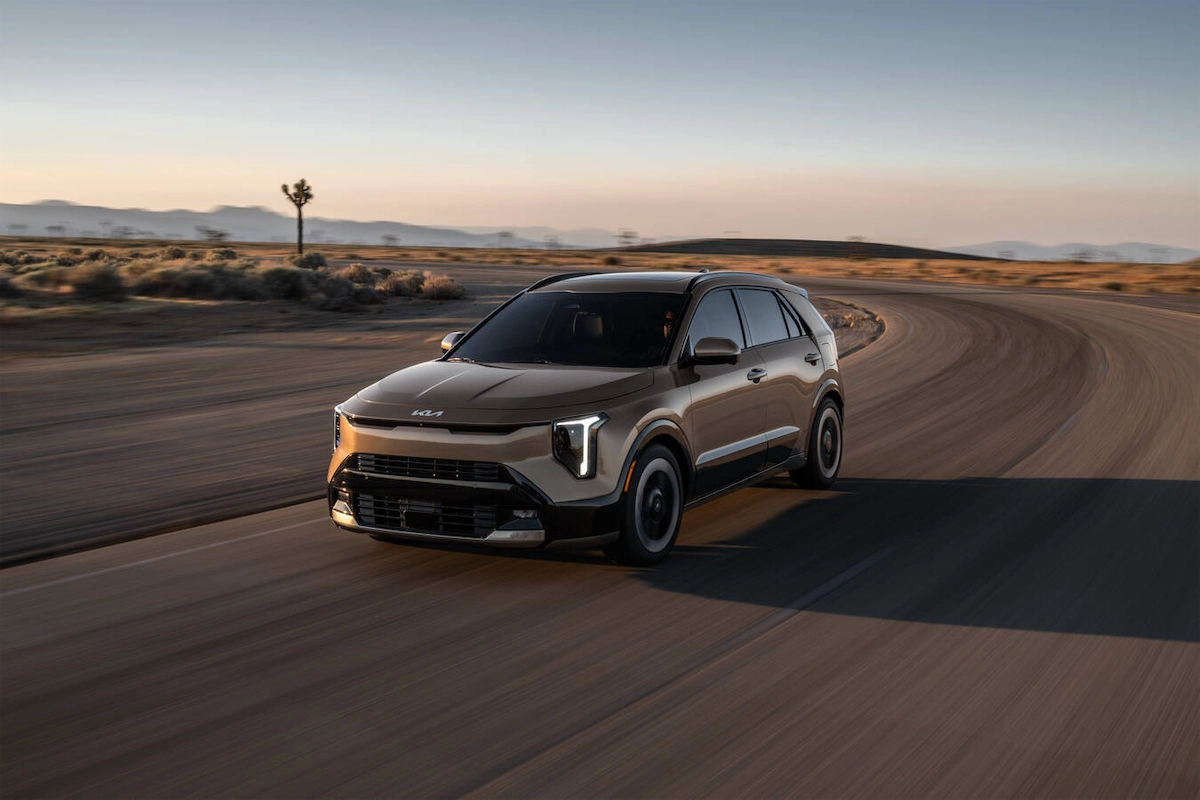 2027 Kia Niro driving on a desert road