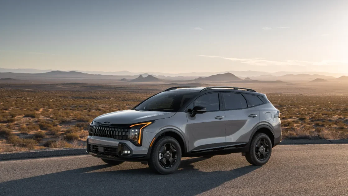 2027 Kia Sportage X-Line front three-quarter view in the desert