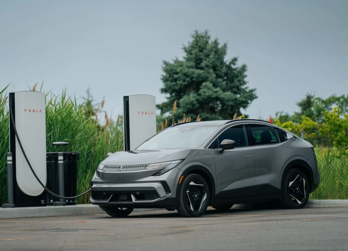 2027 Mitsubishi Eclipse Sportback EV using a Tesla Supercharger