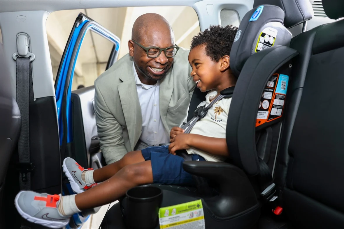 Father and son smiling together after a free safety check