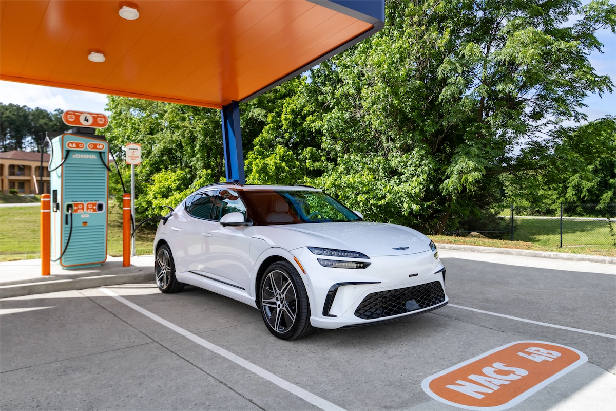 Genesis GV60 parked at a Rechargery during a family road trip