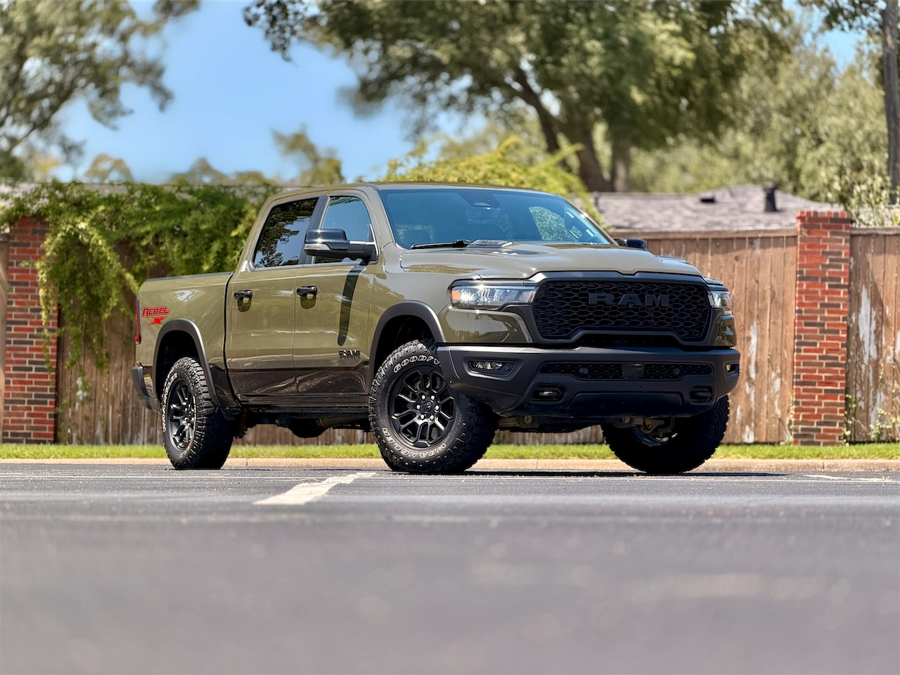 2026 Ram 1500 Rebel X front three-quarter in Tank green