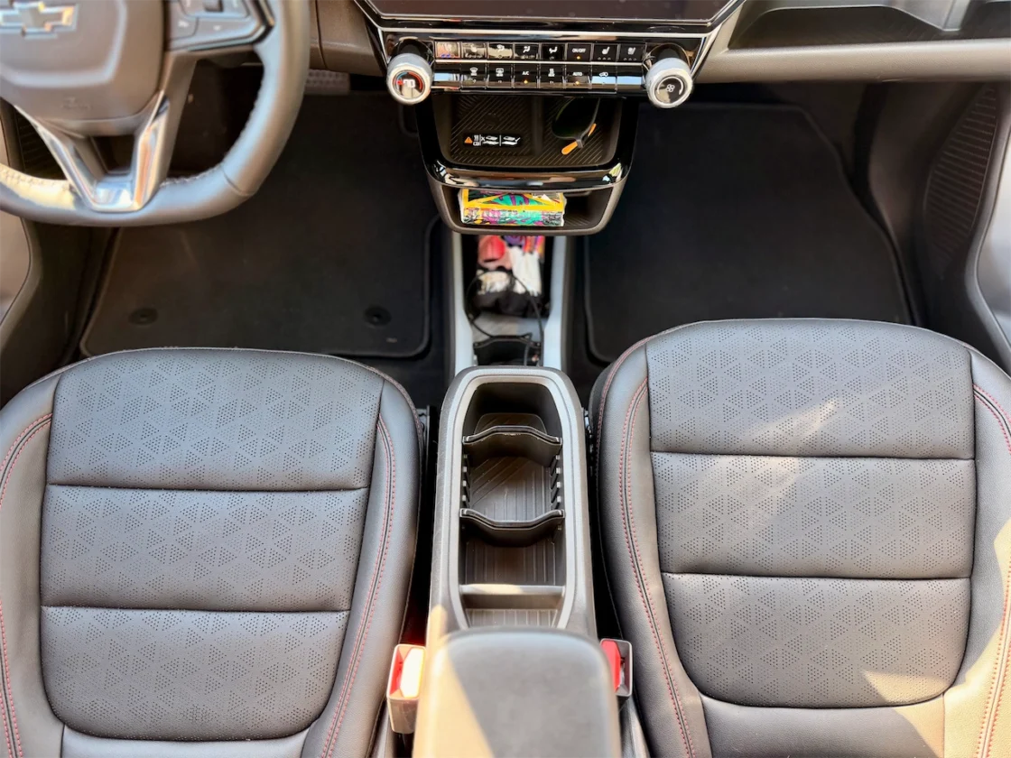 Center console storage, open trays, and cup holders