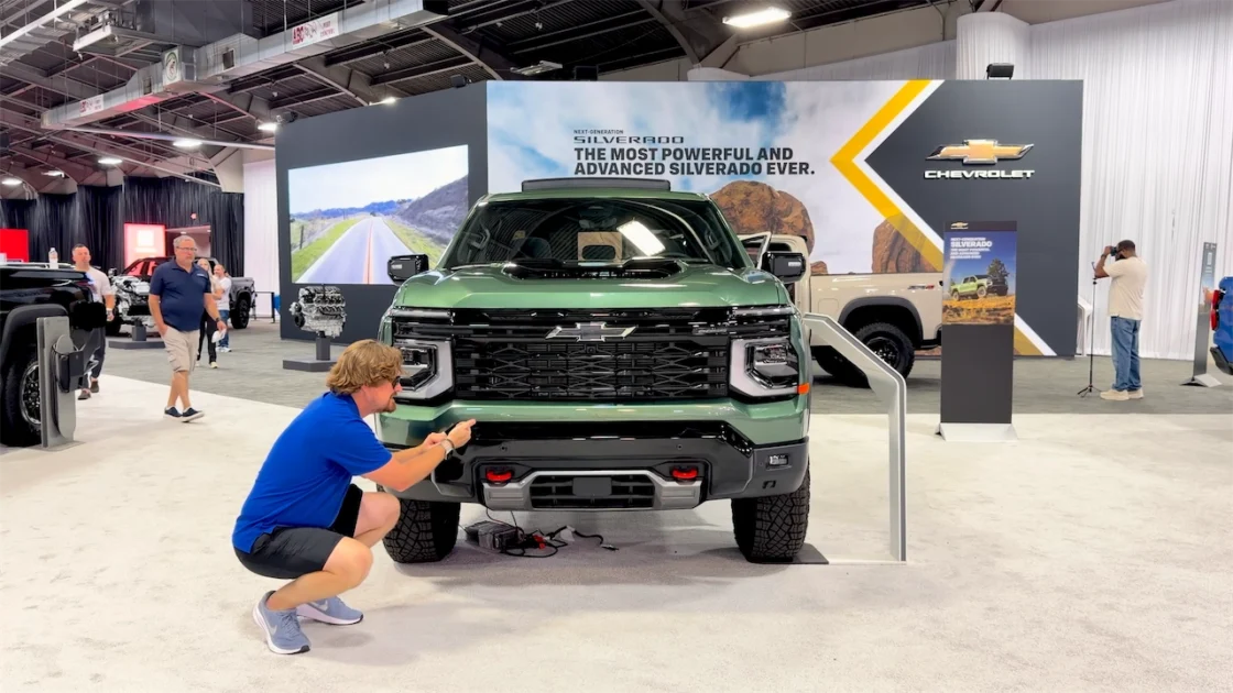 Front end of the 2027 Silverado Trail Boss with red tow hooks