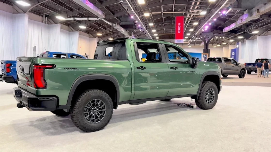 Rear view of the green 2027 Silverado Trail Boss