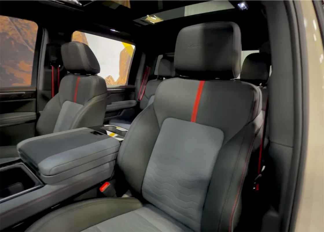 Front seats of the 2027 Chevrolet Silverado ZR2 with gray upholstery and red accents