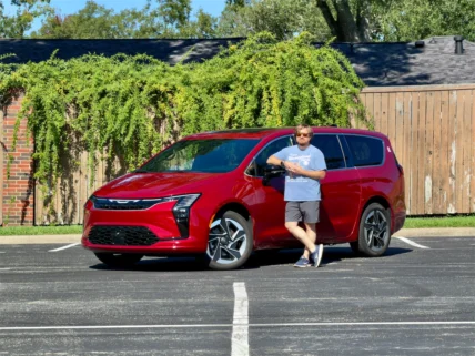 2027 Chrysler Pacifica Limited AWD in Red Hot Pearl-Coat parked in a driveway