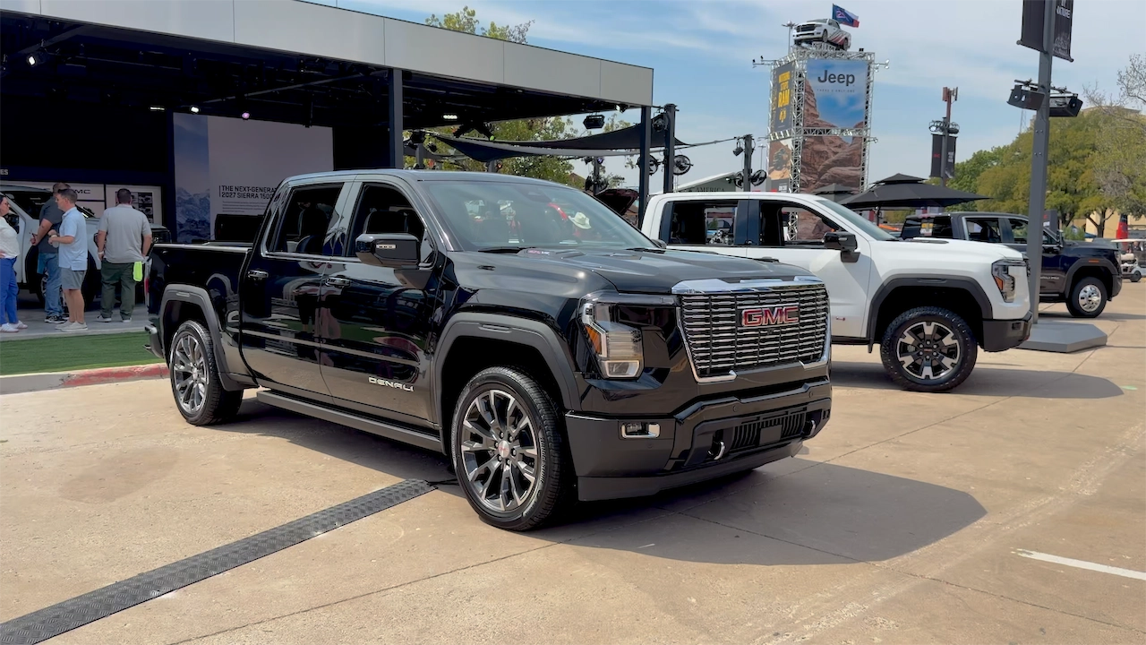 Front three-quarter view of a black 2027 GMC Sierra Denali
