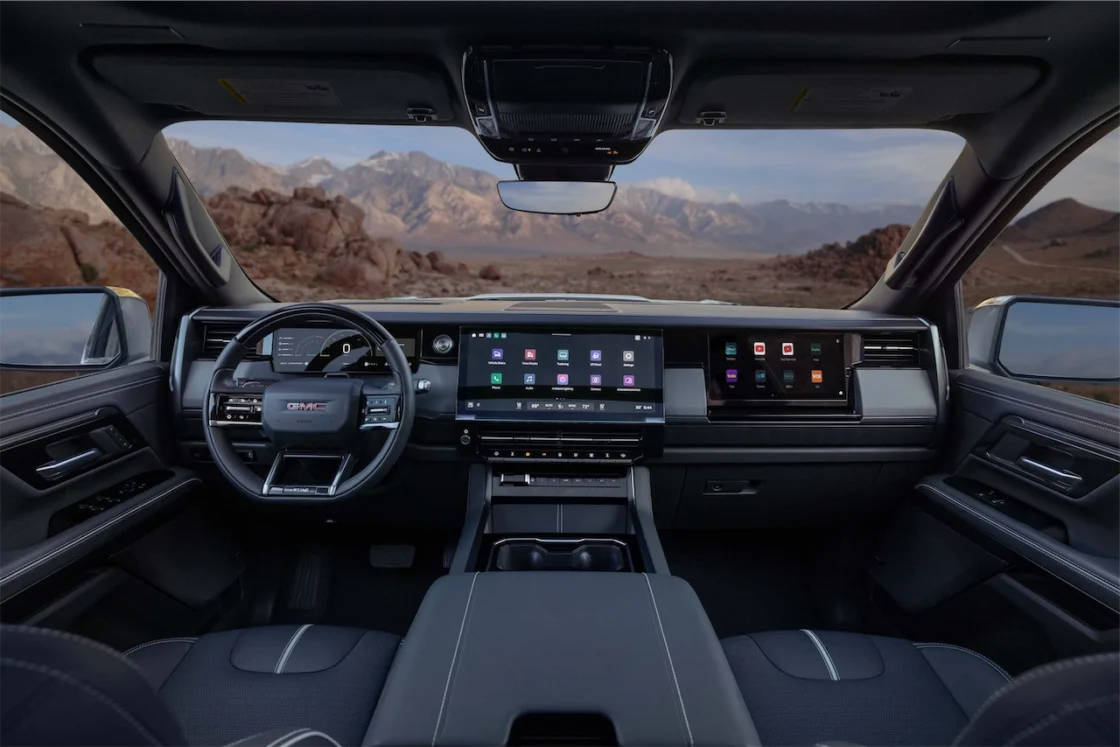 2027 GMC Sierra AT4 dashboard with touchscreen and passenger display