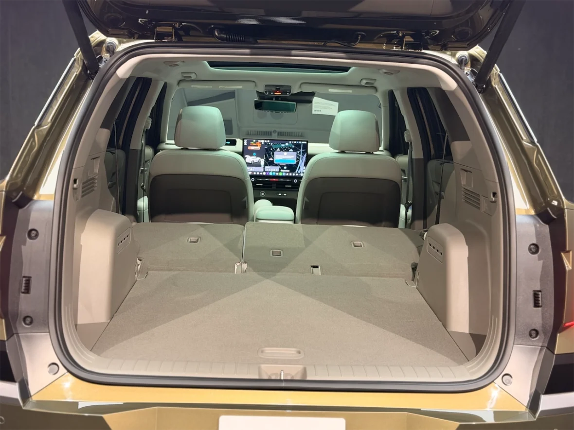 Interior view of the back of a vehicle showing the spacious cargo area with the rear seats folded down.