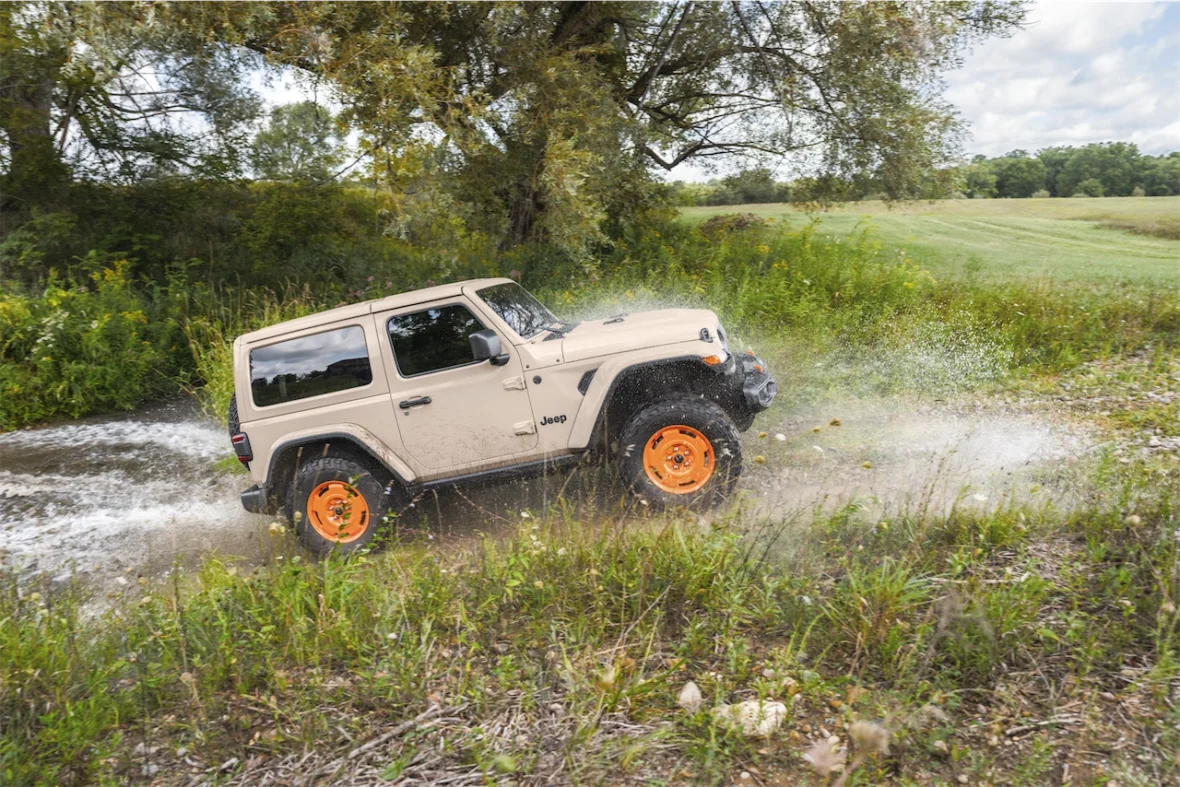 2027 Jeep Wrangler JL-2A splashing through water off-road