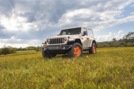 2027 Jeep Wrangler JL-2A two-door in Gobi parked in a field