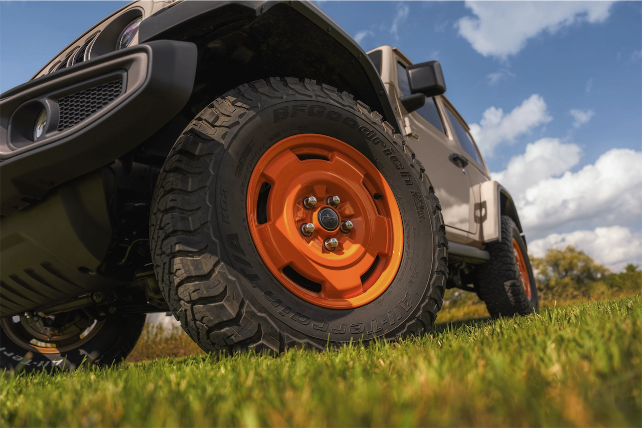 Orange 17-inch retro wheel with 33-inch BFGoodrich KO2 all-terrain tire