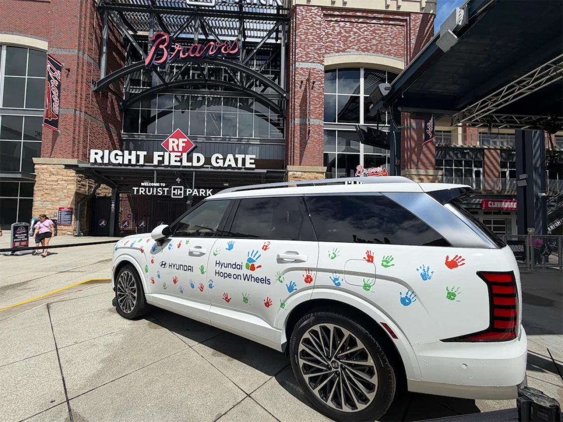 Hyundai Hope on Wheels Palisade with colorful handprints outside Truist Park