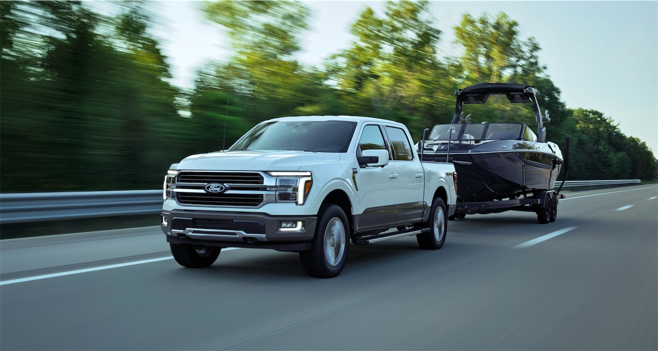 2027 Ford F-150 King Ranch towing a boat using BlueCruise