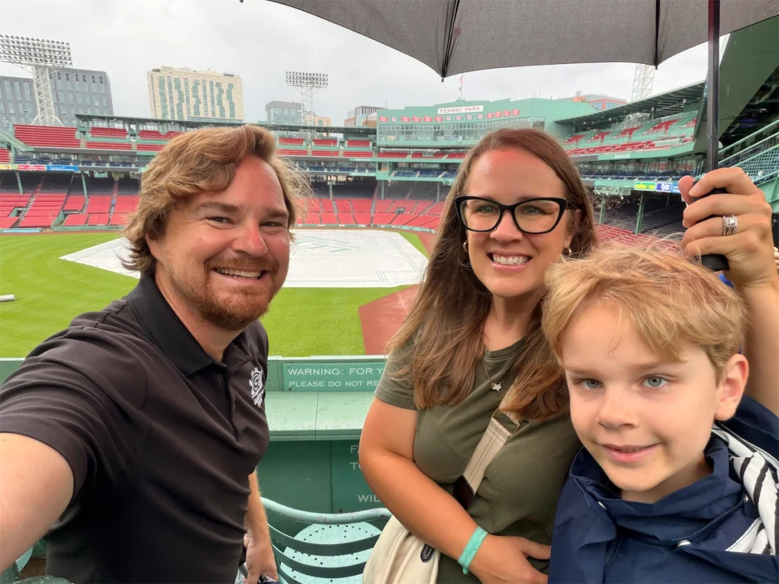 Cory, Holli and Tucker Fourniquet taking a family selfie at Fenway Park