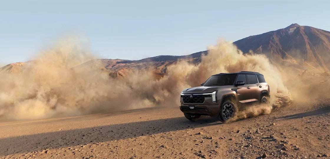 The all-new Mitsubishi Montero drives off-road, kicking up dust on a desert trail