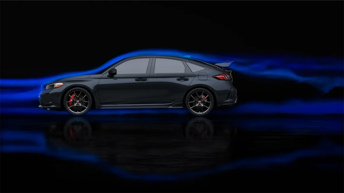 Side profile of a Civic Type R in a dark studio with blue light streaks