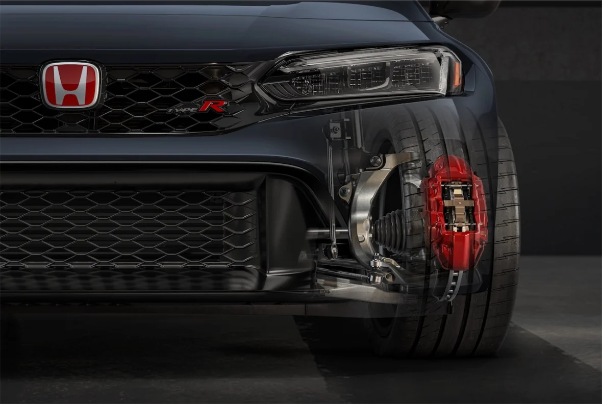 Cutaway view of the Civic Type R front suspension and red brake caliper behind the wheel