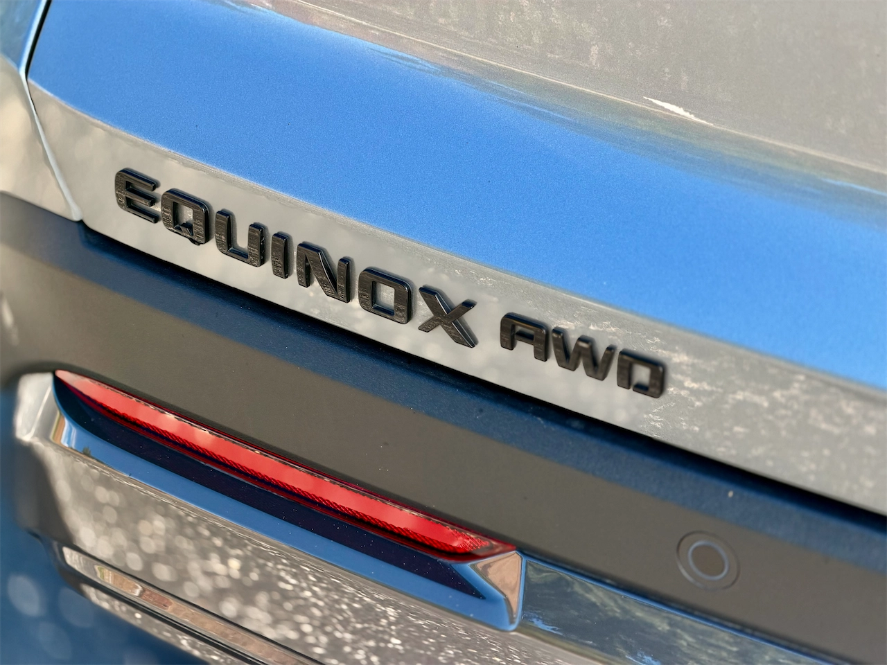 EQUINOX AWD badge on the liftgate of the 2026 Chevrolet Equinox ACTIV