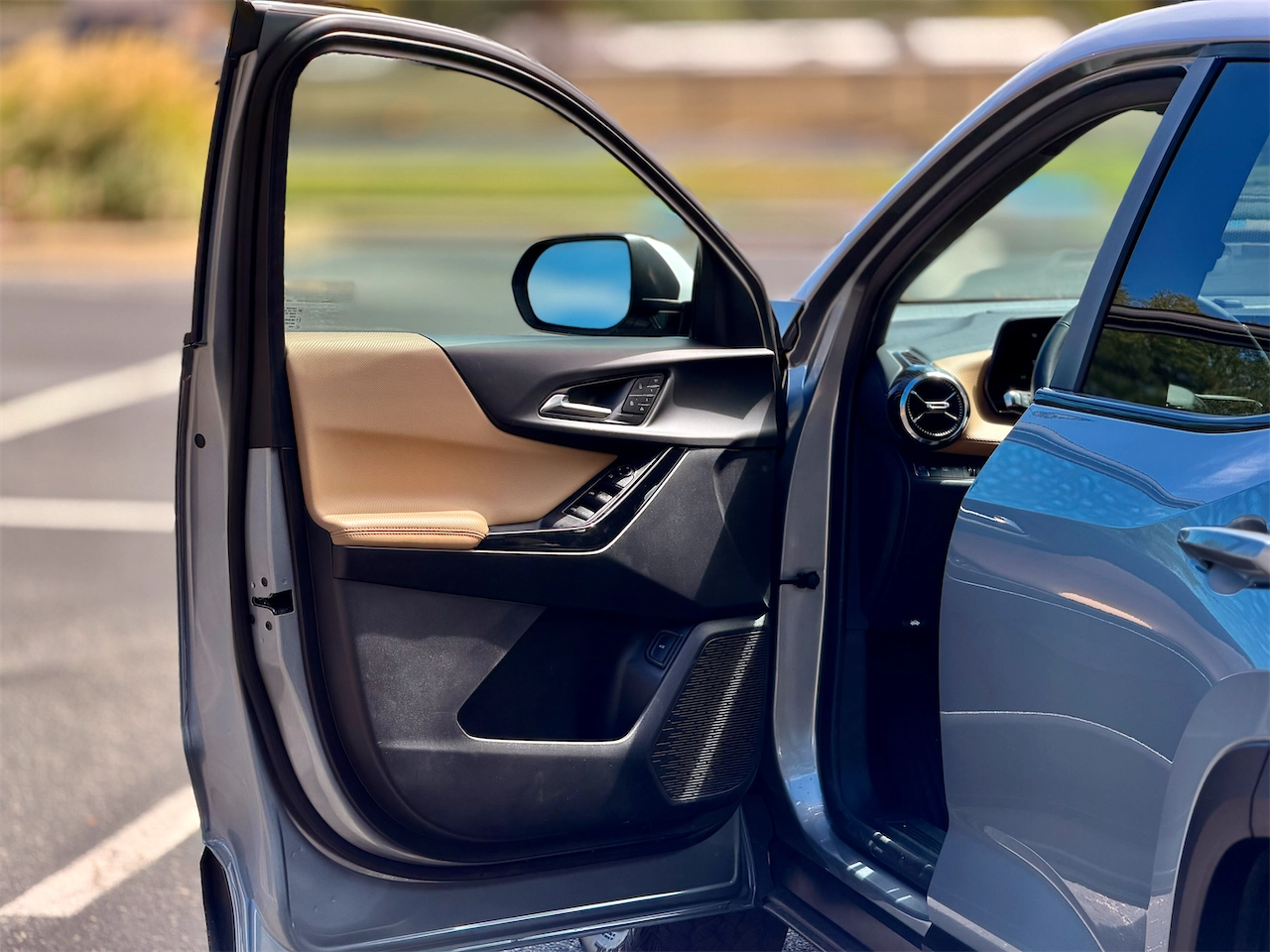 Open driver door and Maple Sugar interior of the 2026 Equinox ACTIV