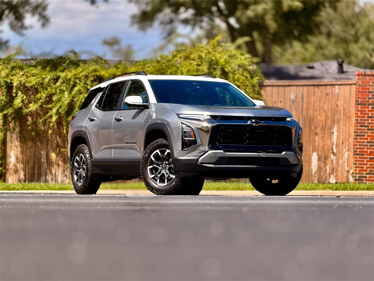 Front three-quarter view of the 2026 Equinox ACTIV on all-terrain tires