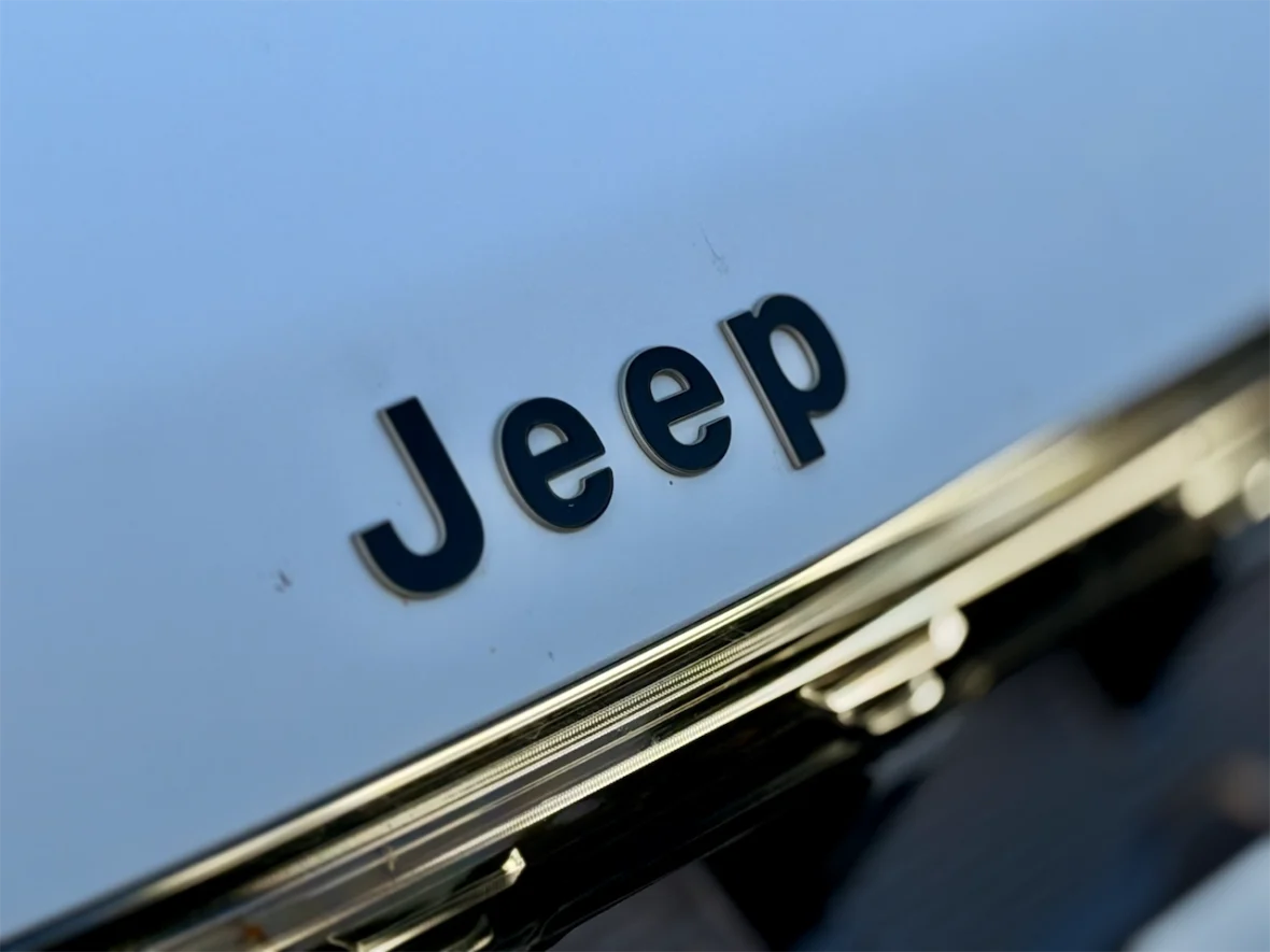 Close-up of the Jeep logo on a vehicle.