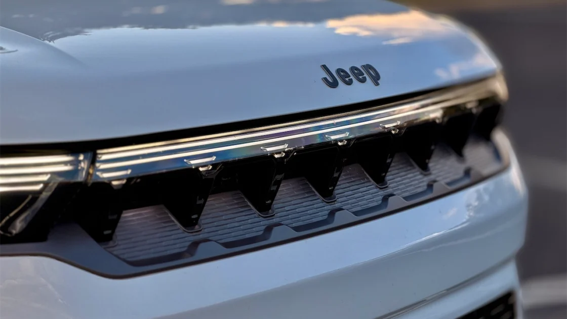 Jeep logo above an illuminated seven-slot grille